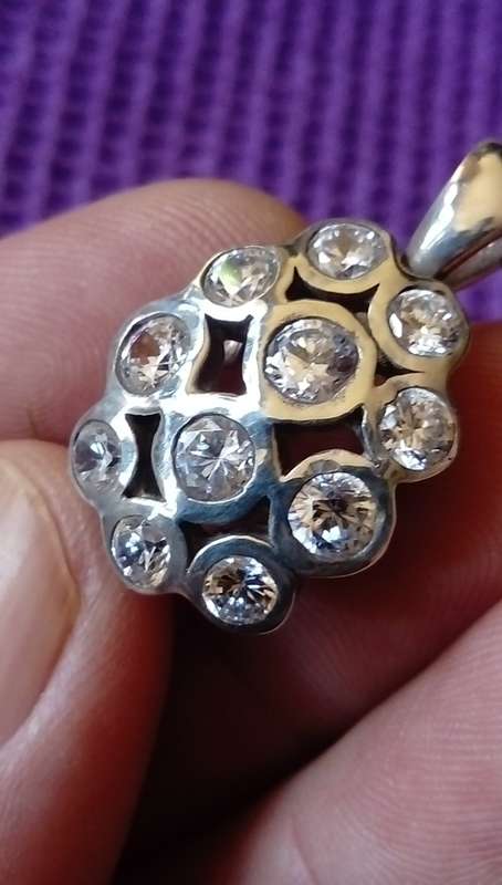 SOLID STERLING SILVER PENDANT.  WHITE  CZ STONES.