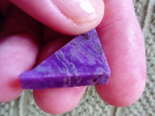 RARE SUGILITE.  NICE TRIANGLE SHAPE , TRIMMED ETC