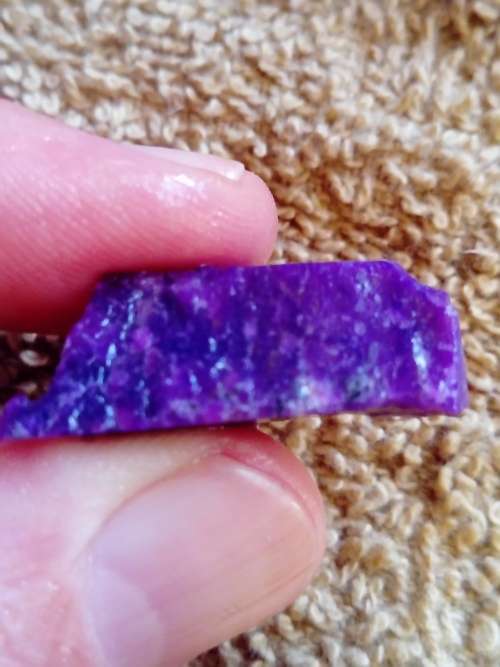 GRAPE PURPLE SUGILITE.  TRANSLUCENT EDGES.