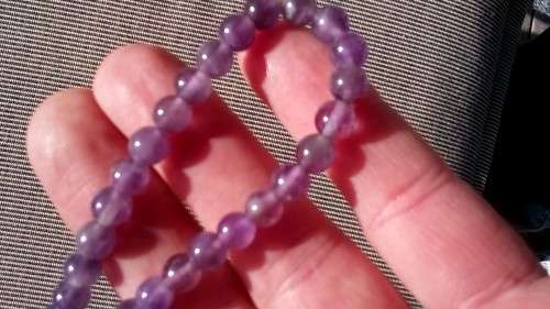 AMETHYST GEMSTONE BRACELET , ON ELASTIC.  6.3 MM ROUND BEADS.