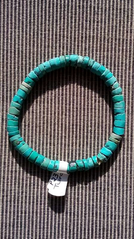 TURQUOISE GEMSTONE BRACELET.  ON ELASTIC.