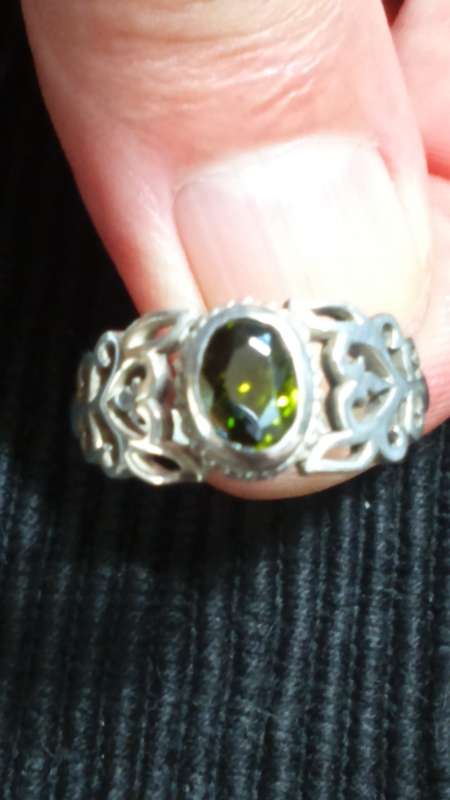 SOLID STERLING SILVER RING.  SIZE Q.  GREEN CZ STONE.
