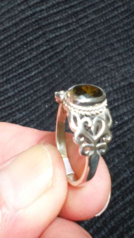 SOLID STERLING SILVER RING.  SIZE Q.  GREEN CZ STONE.