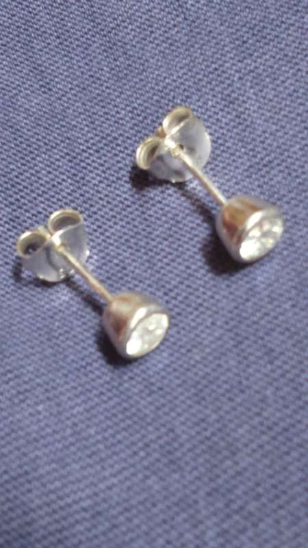 SOLID STERLING SILVER STUD EARRINGS.  5 MM DIAMOND SIMULANT CZ STONE.  TUBE SETTING.