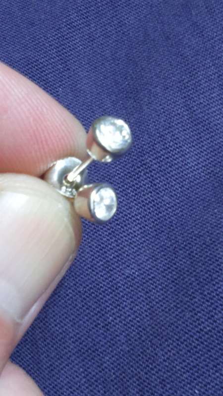 SOLID STERLING SILVER STUD EARRINGS.  5 MM DIAMOND SIMULANT CZ STONE.  TUBE SETTING.