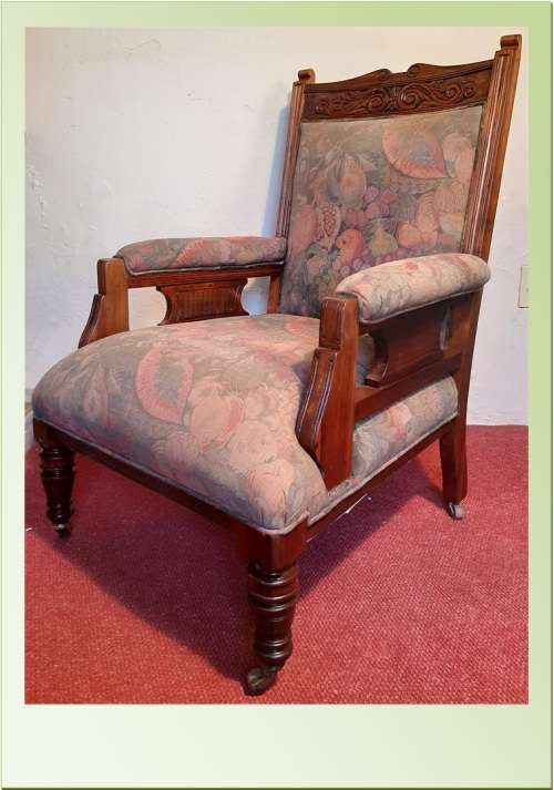 ANTIQUE EDWARDIAN GRANDFATHER CHAIR ON CASTORS  SOLID TEAK