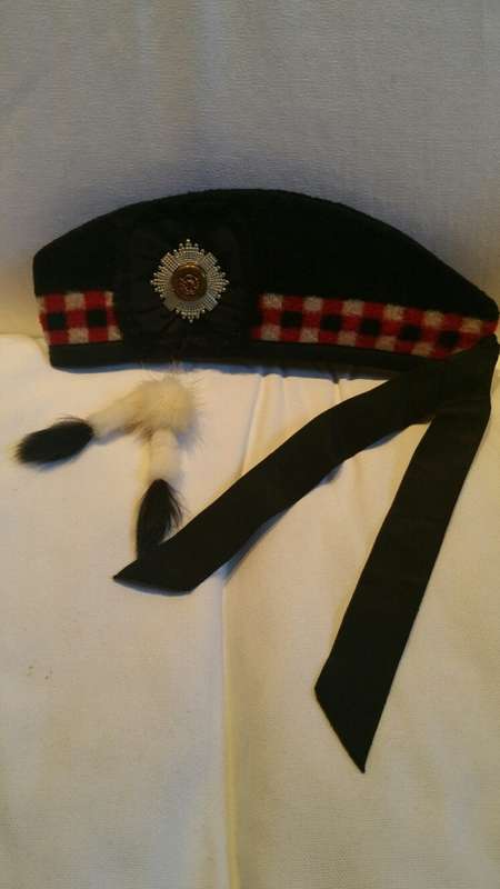 A Scottish Glengarry Beret, with Possibly Royal Scots Order of the Thistle Badge and Good Luck Charm