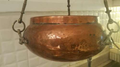 A Vintage Copper and Brass Hanging Plant Holder: Monkey Face Brass Detail