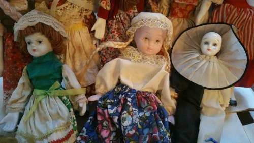 A Collection of 12 Vintage doll, 9 Porcelain and 3 Plastic