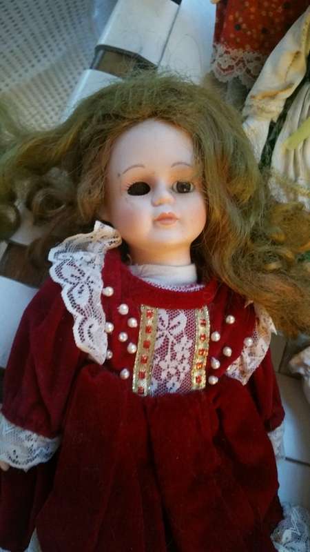 A Collection of 12 Vintage doll, 9 Porcelain and 3 Plastic