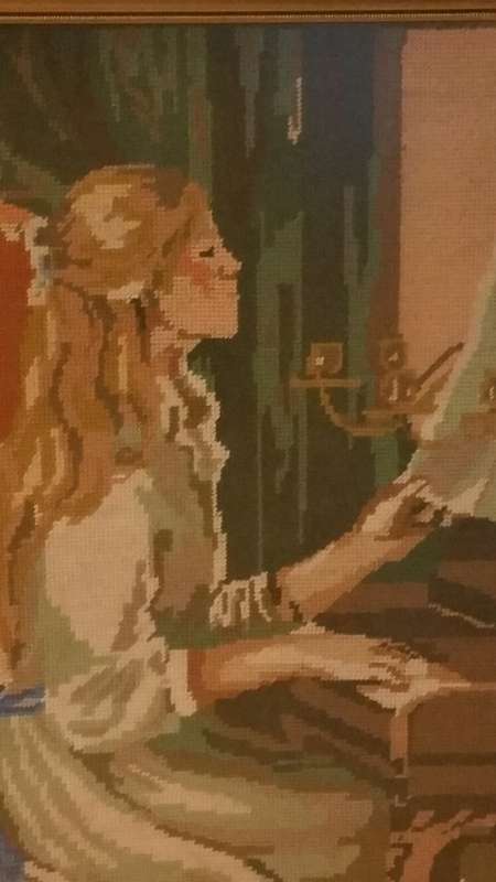 A Large Framed Tapestry of a Young Lady Playing the Piano