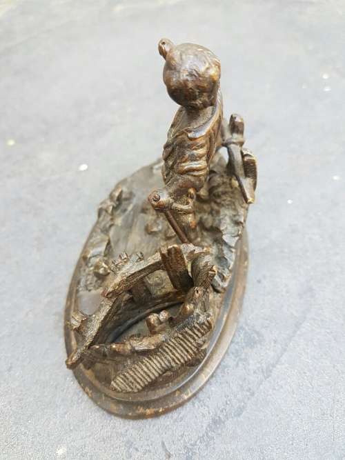A C1900 Parcel Gilt Bronze Casting of a Child in a Landscape with Vesta Holder and Striker