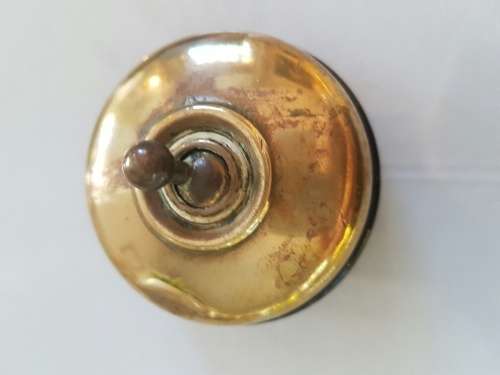A Brass and Ceramic Light Switch SLICK Vitreous 1/5709