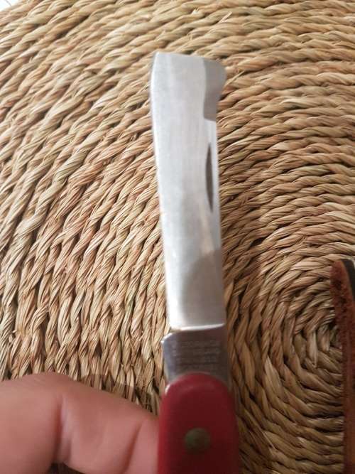 A Vintage Victoria Knox Pocket Knife and Leather Pouch