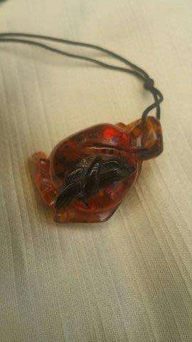 A Chinese Amber Pendant in the Form of a Peach and Insect