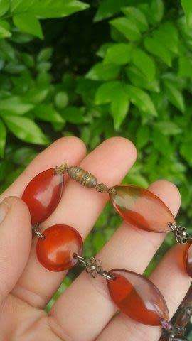 Amber Necklace with Flat Oval and Round Beads and Metal Flower Detail