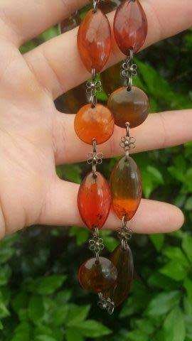 Amber Necklace with Flat Oval and Round Beads and Metal Flower Detail