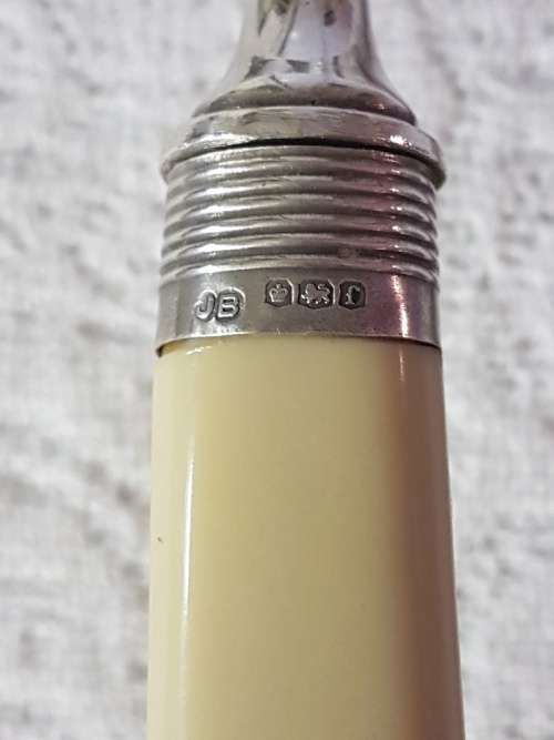 A Vintage EPNS Crumb Scoop with Silver Collar and Ivory Style Celluloid Handle