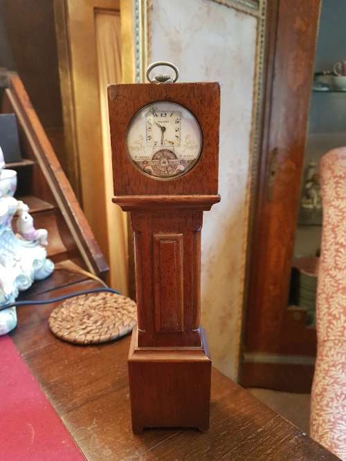 A Magina Swiss Made Pocket Watch( Not Working) in Grandfather Clock Holder