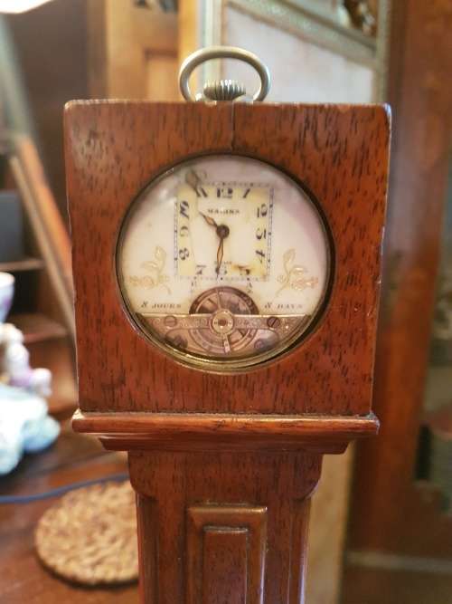 A Magina Swiss Made Pocket Watch( Not Working) in Grandfather Clock Holder