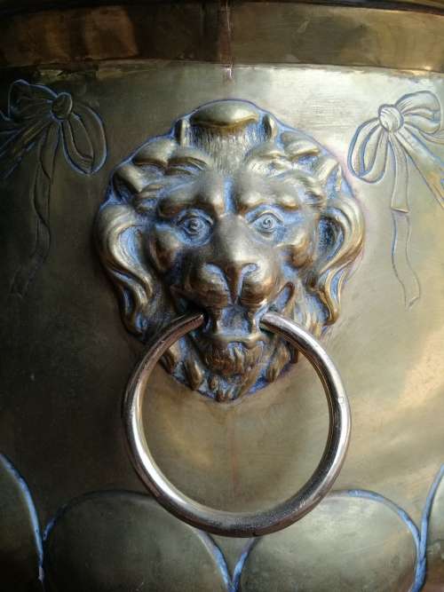 Striking English Brass Jardiniere With Embossed Detail And Robust Lion Ring Handles