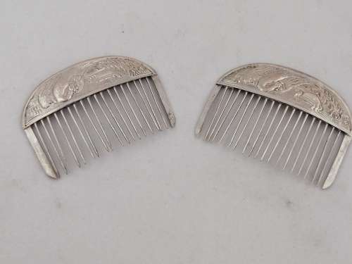 A Pair of Chinese Silver Export Hair Combs With Repousse Peacock Pattern
