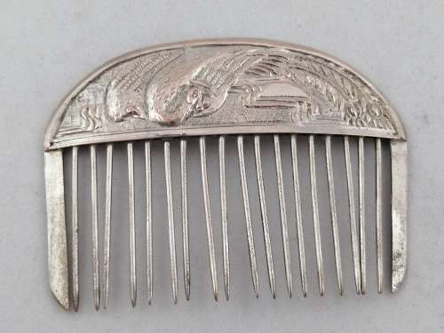 A Pair of Chinese Silver Export Hair Combs With Repousse Peacock Pattern