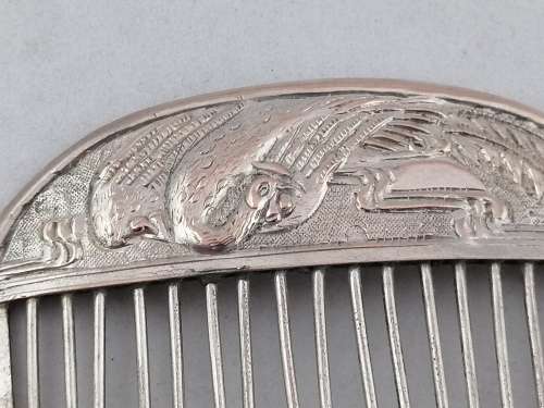 A Pair of Chinese Silver Export Hair Combs With Repousse Peacock Pattern