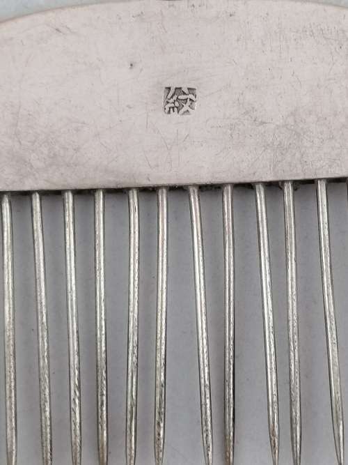 A Pair of Chinese Silver Export Hair Combs With Repousse Peacock Pattern