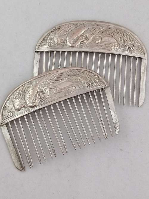 A Pair of Chinese Silver Export Hair Combs With Repousse Peacock Pattern