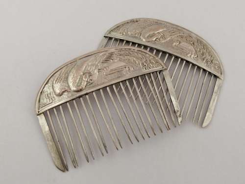 A Pair of Chinese Silver Export Hair Combs With Repousse Peacock Pattern