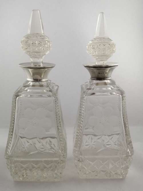 A Pair of Henry Perkins and Sons Silver Collared Scent Bottles