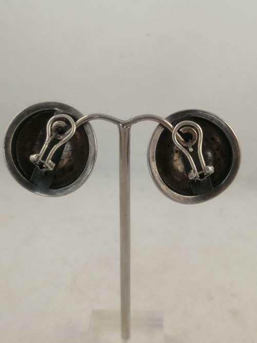 A Striking Pair of Hammered Silver Earrings