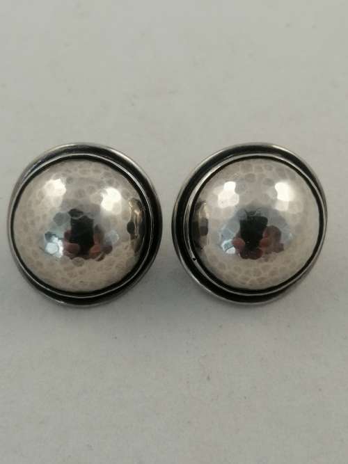 A Striking Pair of Hammered Silver Earrings