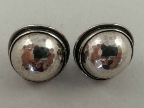 A Striking Pair of Hammered Silver Earrings