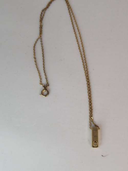 A  BEAUTIFUL SMALL  GOLD PLATED BAR PENDANT WITH A CZ ON A MARKED CHAIN ,