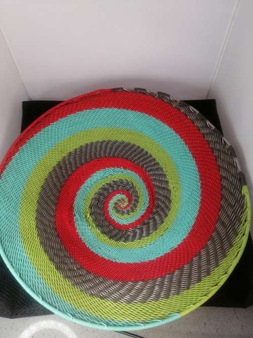 A SOUTH AFRICAN ARTS AND CRAFTS HANDMADE COLOURFUL  TELEPHONE WIRE FRUIT BASKET