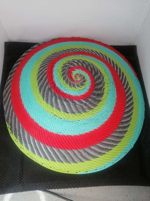 A SOUTH AFRICAN ARTS AND CRAFTS HANDMADE COLOURFUL  TELEPHONE WIRE FRUIT BASKET
