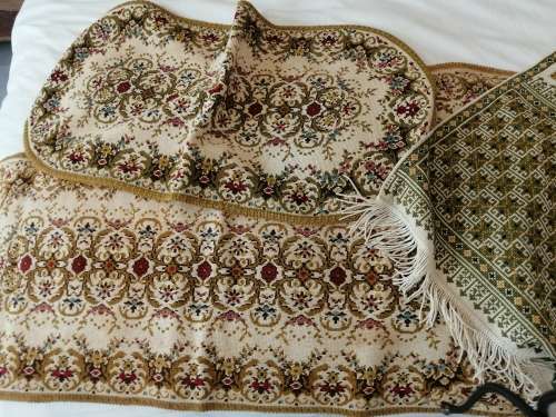 A SELECTION OF ANTIQUE TABLEWARE SOME OF WHICH ARE EMBROIDERED