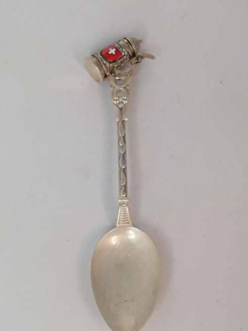 A SWISS SILVER SOUVENIR COFFEE SPOON WITH A TANKARD OR STEIN AT THE TOP