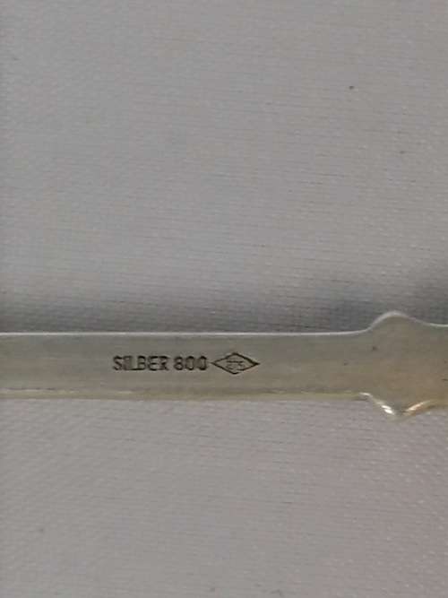 A SWISS SILVER SOUVENIR COFFEE SPOON WITH A TANKARD OR STEIN AT THE TOP