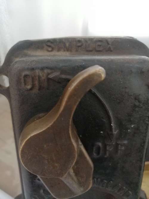 A VINTAGE BRASS SIMPLEX PLUG SWITCH