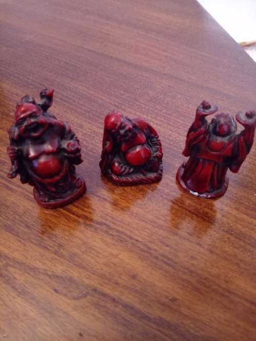 THREE VINTAGE MINATURE BUDDA RESIN FIGURINES