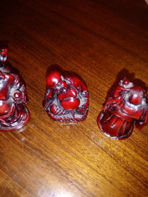 THREE VINTAGE MINATURE BUDDA RESIN FIGURINES