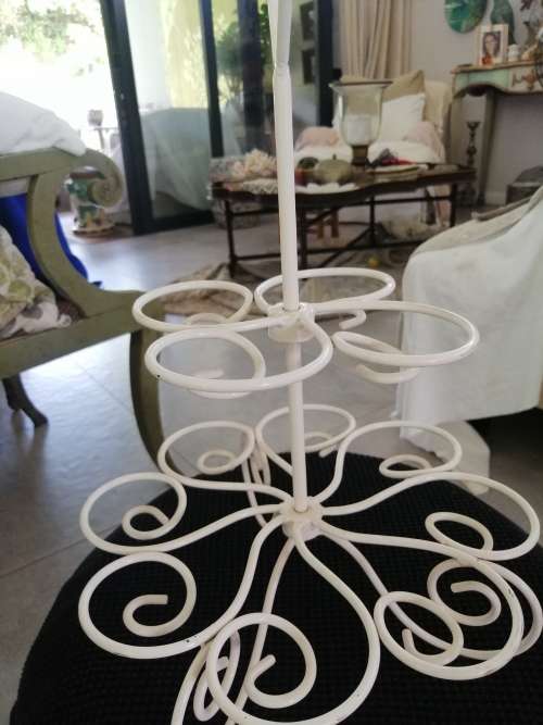 A PRETTY WHITE METAL CUPCAKE STAND