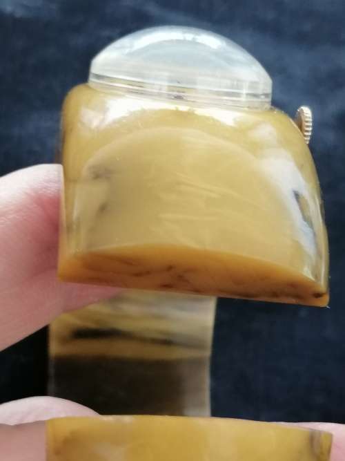 A STUNNING CIRCA 1940 BAKELITE MARBLED BUTTERSCOTCH HINGED BANGLE WATCH