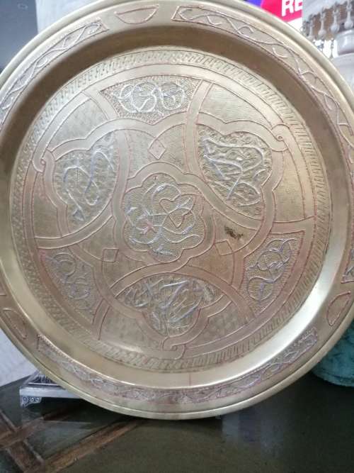 A BEAUTIFUL ARABIC BRASS TRAY WITH RELIEF WORK IN COPPER AND SILVER