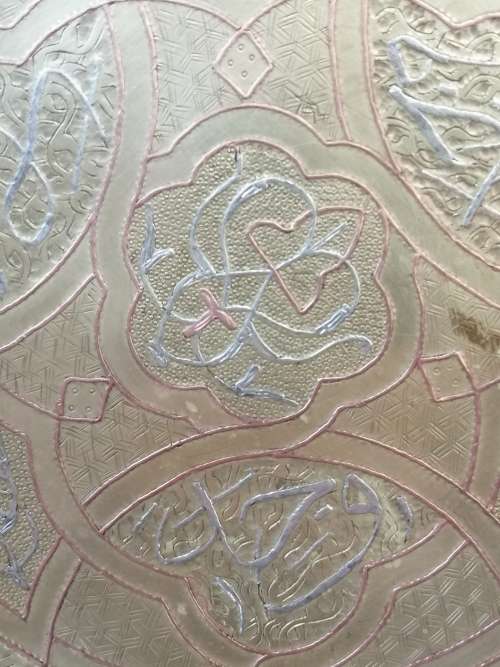 A BEAUTIFUL ARABIC BRASS TRAY WITH RELIEF WORK IN COPPER AND SILVER