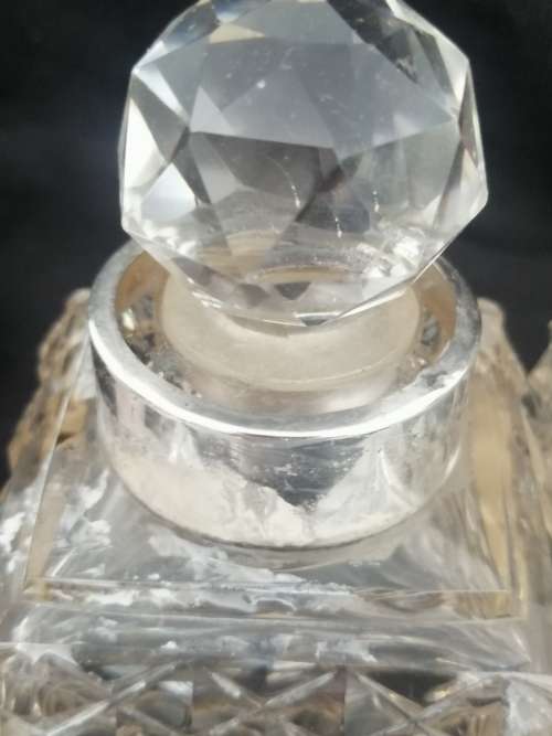 THREE CRYSTAL PERFUME BOTTLES WITH STERLING SILVER COLLAR`S