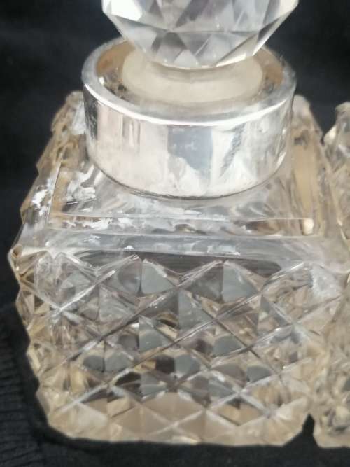 THREE CRYSTAL PERFUME BOTTLES WITH STERLING SILVER COLLAR`S